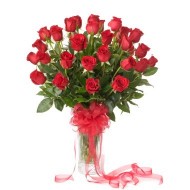 Three dozen roses in a glass vase